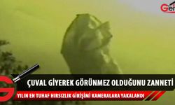 Çuval giyerek gözükmediğini sanan hırsızın güvenlik kamerasındaki komik anları