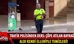 Duyarlı trafik polisi Türk bayrağını çöpten aldı!
